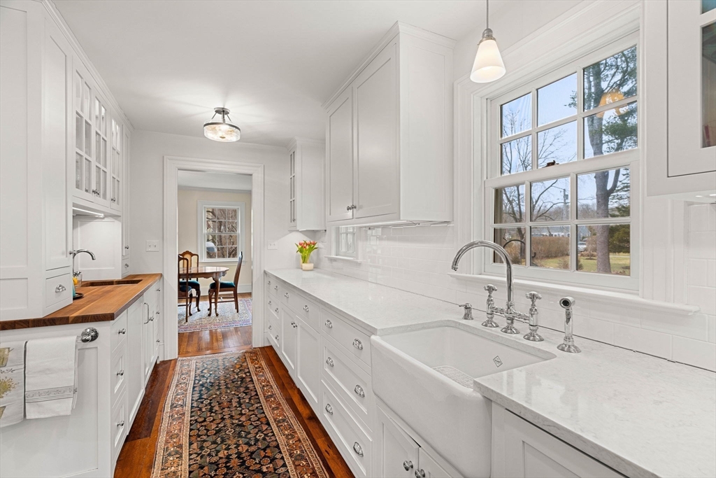 9 Windemere Park Manchester, MA 01944 - Photo 6 of 31 a kitchen with a sink stove and cabinets