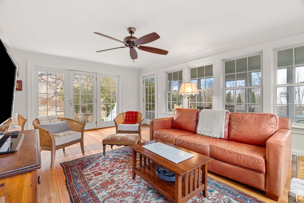 9 Windemere Park Manchester, MA 01944 - Photo 10 of 31 a living room with furniture a flat screen tv and a large window