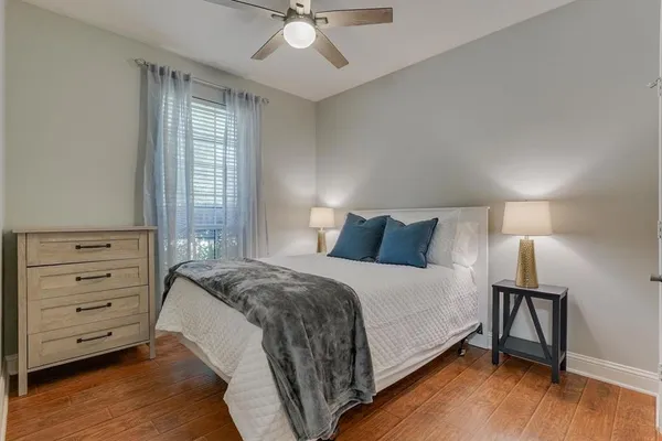 a bedroom with a bed and a dresser