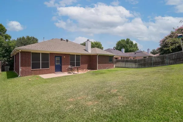 a front view of a house with a garden and porch