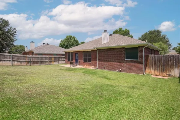 a front view of house with yard and swimming pool