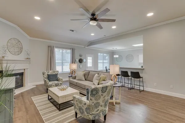 a living room with furniture and a fireplace