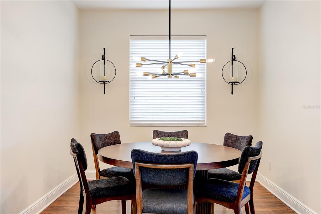 2410 Hawks Point Court Ruskin, FL 33570 - Photo 13 of 82 a dining room with furniture and window