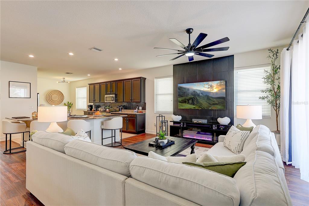 2410 Hawks Point Court Ruskin, FL 33570 - Photo 25 of 82 a living room with furniture a flat screen tv and a large window