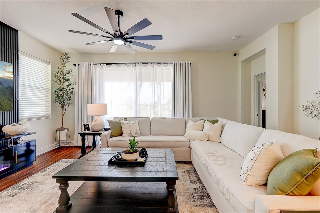 2410 Hawks Point Court Ruskin, FL 33570 - Photo 26 of 82 a living room with furniture and a large window