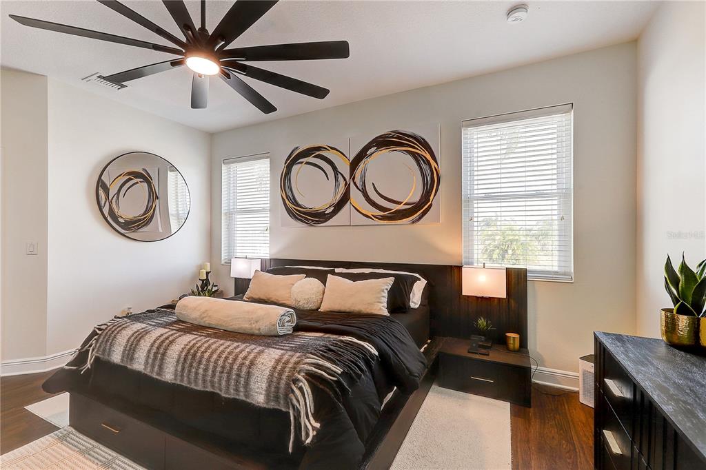 2410 Hawks Point Court Ruskin, FL 33570 - Photo 32 of 82 a bedroom with a bed and a chandelier