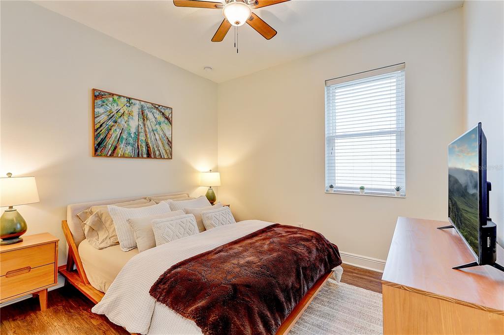 2410 Hawks Point Court Ruskin, FL 33570 - Photo 41 of 82 a bedroom with a bed and a flat screen tv