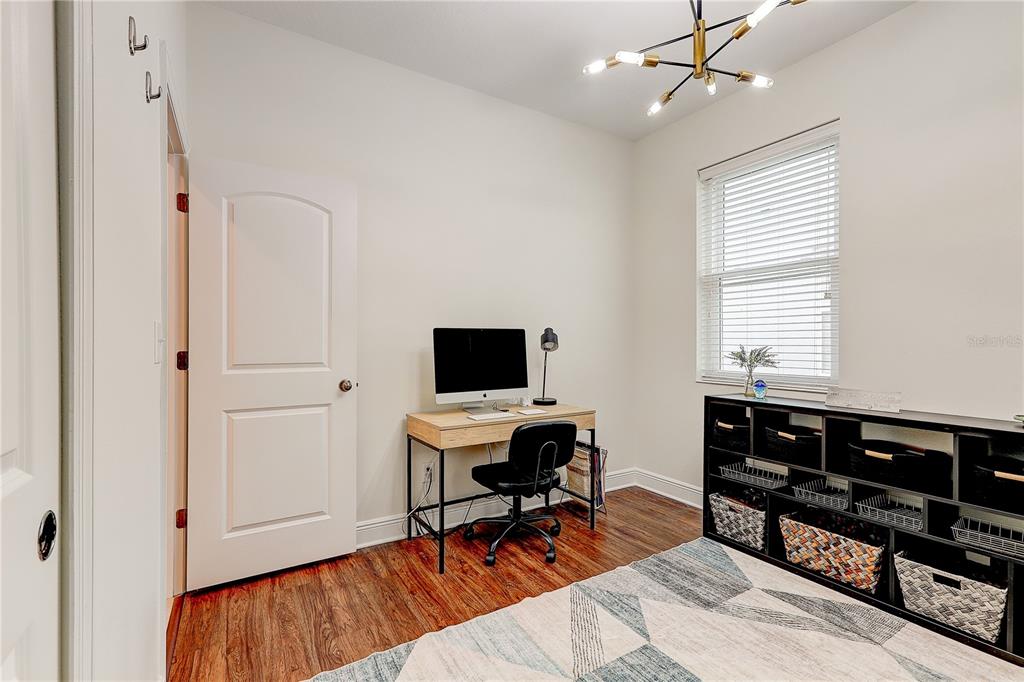 2410 Hawks Point Court Ruskin, FL 33570 - Photo 45 of 82 a view of a workspace with furniture and a window