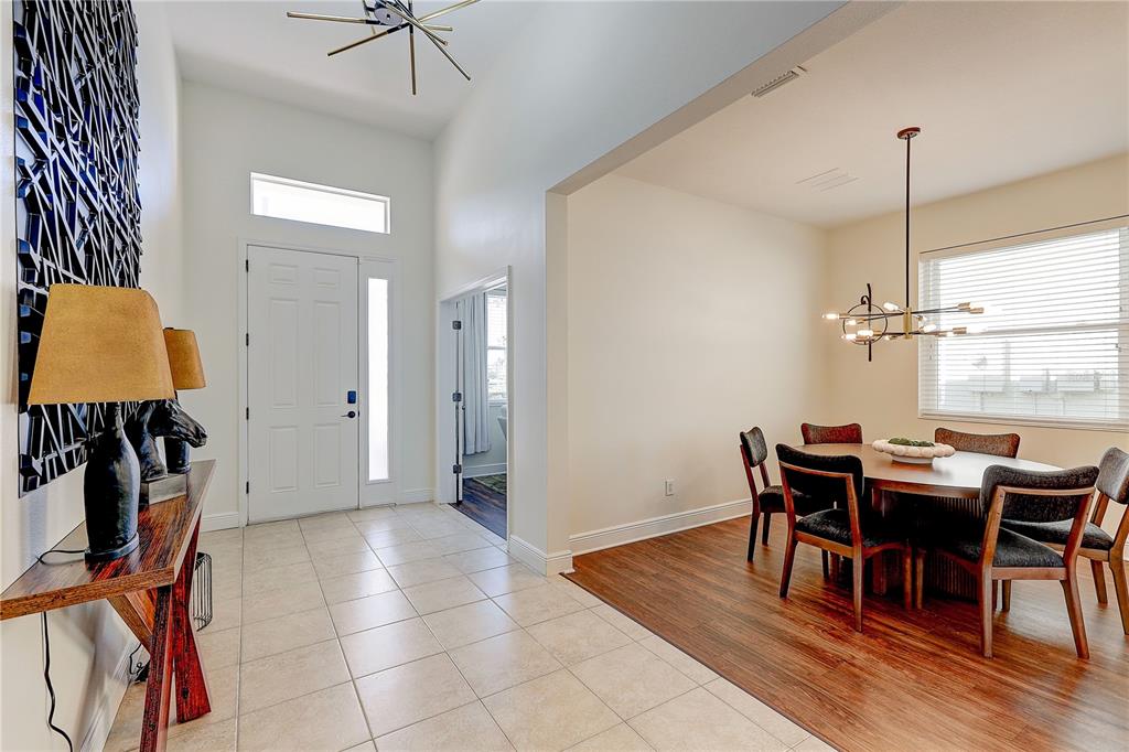 2410 Hawks Point Court Ruskin, FL 33570 - Photo 6 of 82 a view of a dining room with furniture and wooden floor