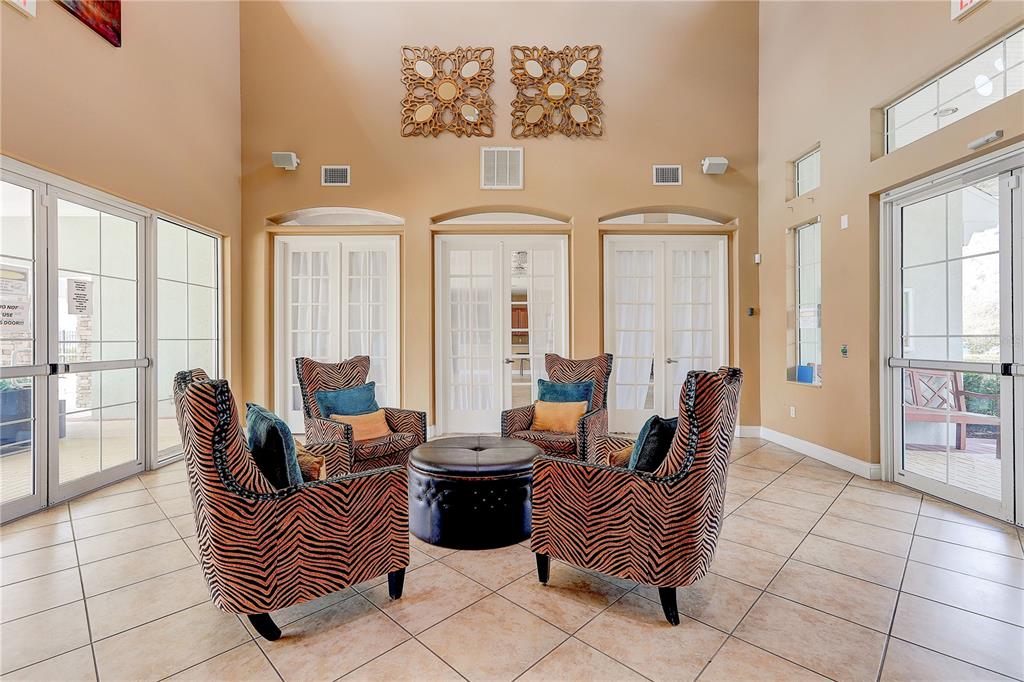 2410 Hawks Point Court Ruskin, FL 33570 - Photo 66 of 82 a living room with furniture and large windows