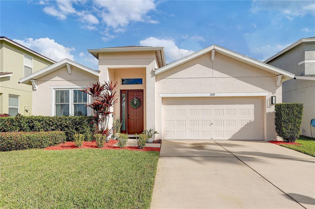 2410 Hawks Point Court Ruskin, FL 33570 - Photo 77 of 82 front view of a house with a yard