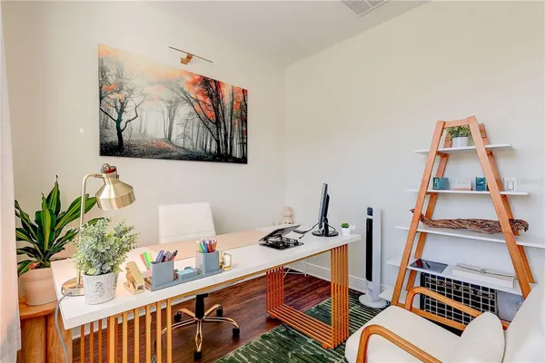 a dining room with furniture and window