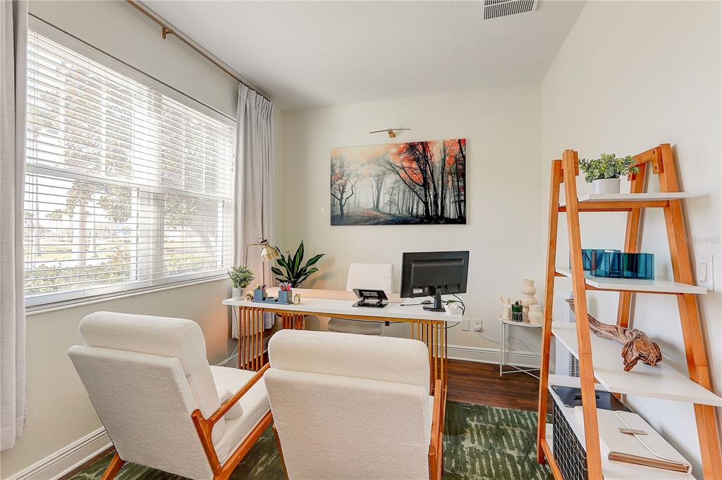 2410 Hawks Point Court Ruskin, FL 33570 - Photo 10 of 82 a dining room with furniture a large window and a flat screen tv