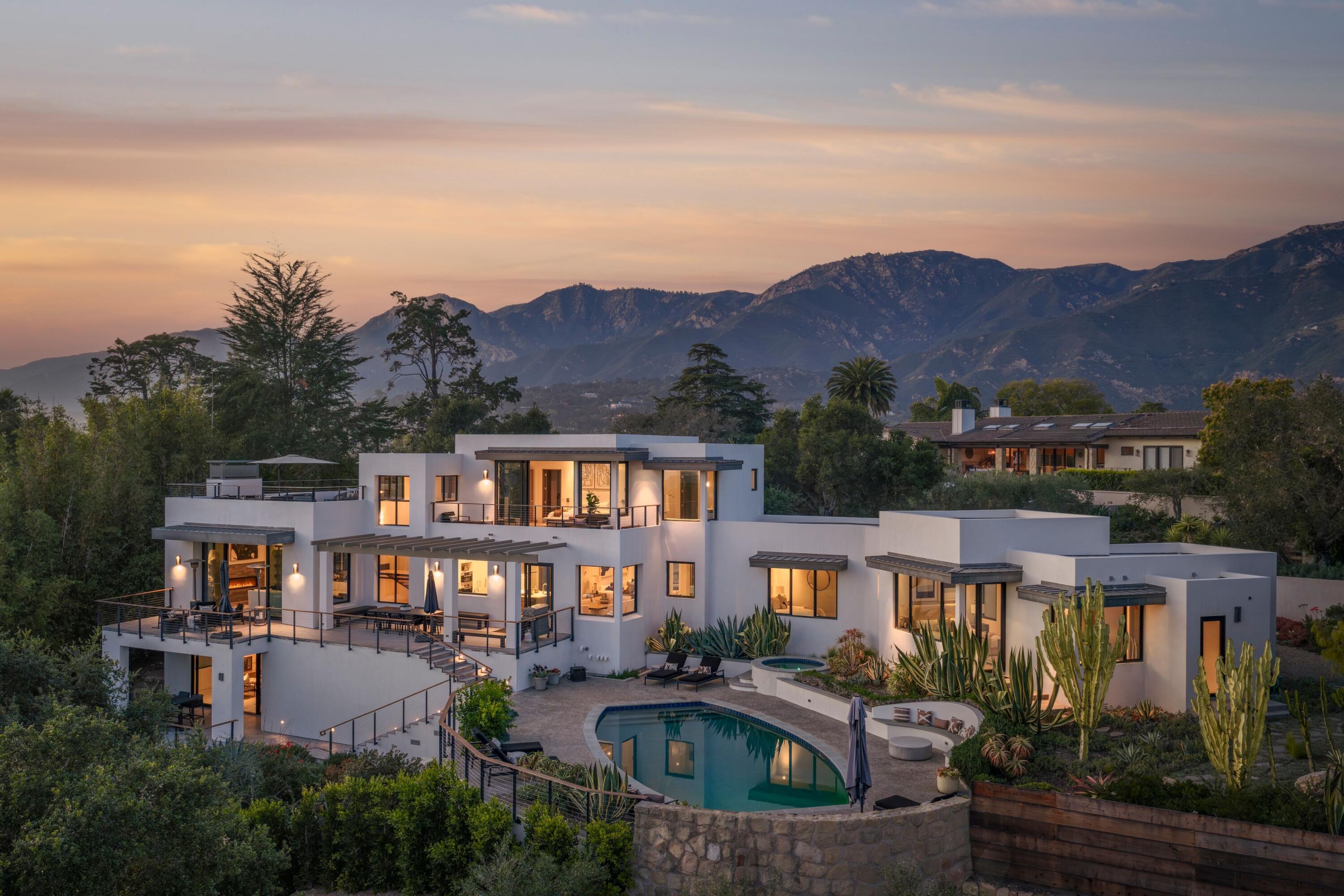 2. Exterior at Dusk with Pool Deck and M