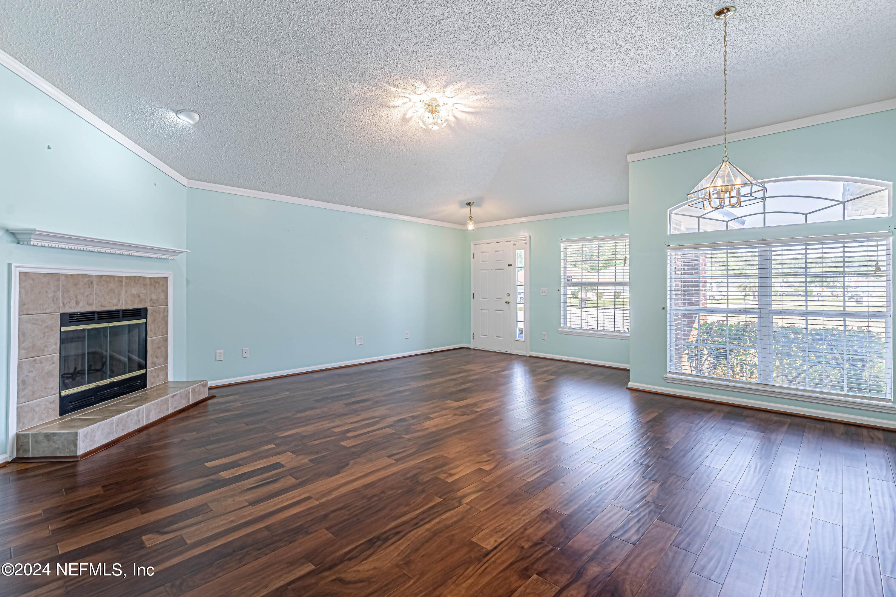 9380 Lockheed Lane Jacksonville, FL 32221 - Photo 12 of 40 a view of an empty room with wooden floor and a window