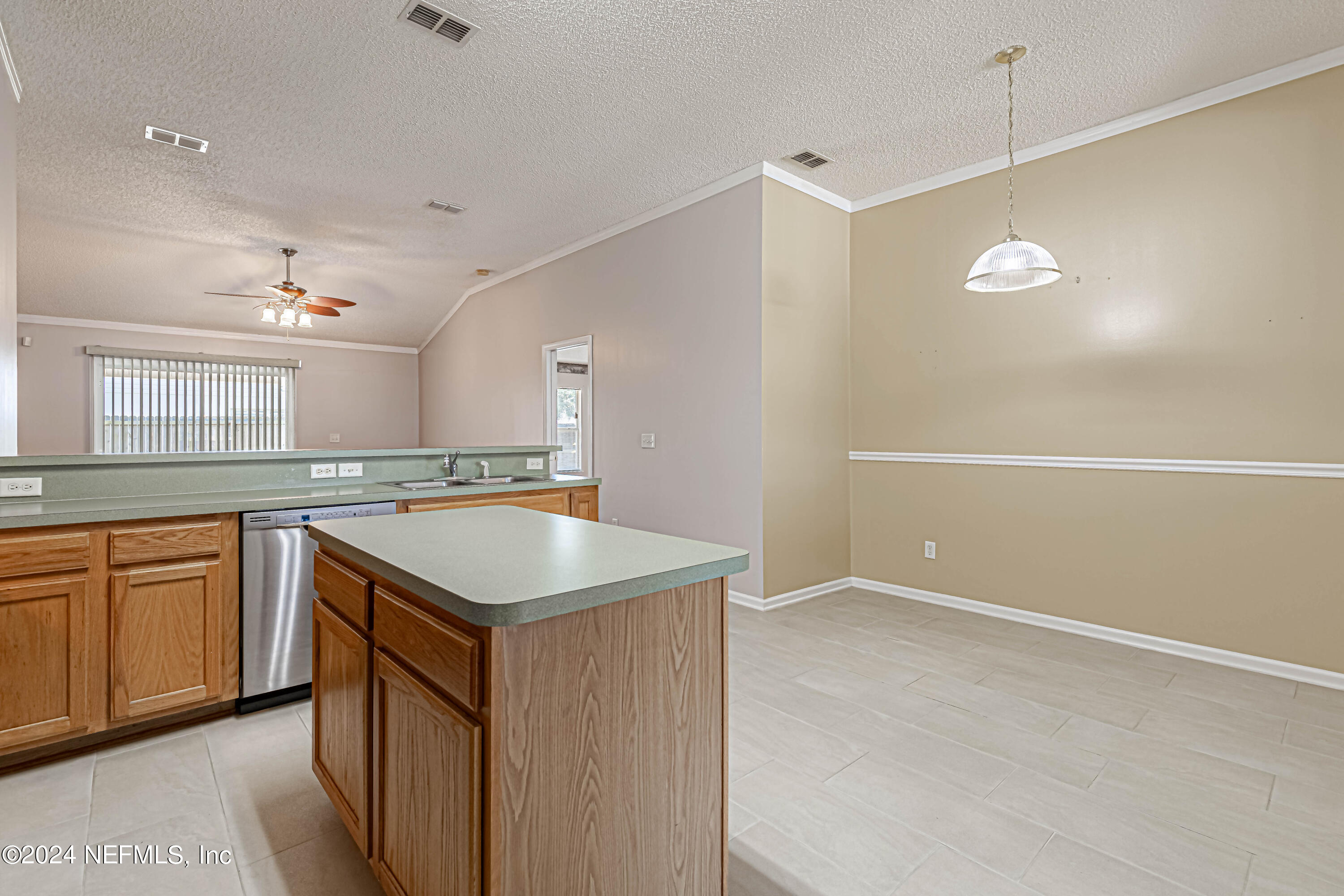 9380 Lockheed Lane Jacksonville, FL 32221 - Photo 13 of 40 a kitchen with a sink stove and cabinets