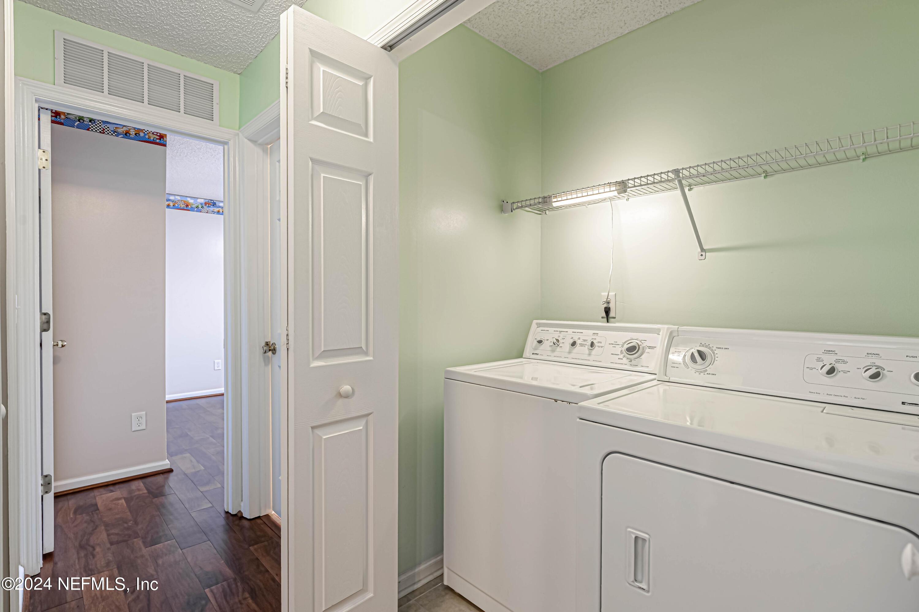 9380 Lockheed Lane Jacksonville, FL 32221 - Photo 22 of 40 a utility room with dryer and washer