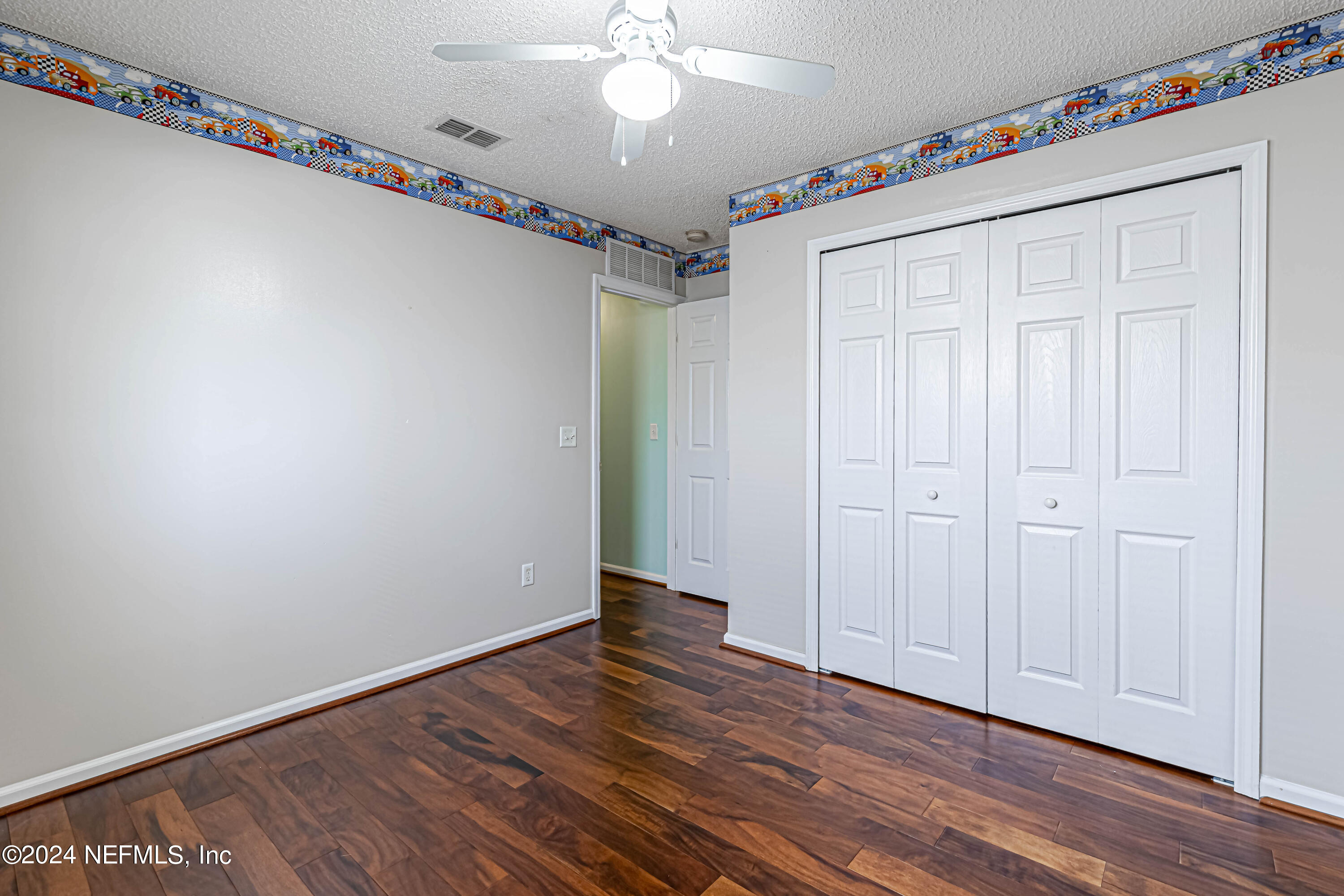 9380 Lockheed Lane Jacksonville, FL 32221 - Photo 24 of 40 a view of an empty room with wooden floor