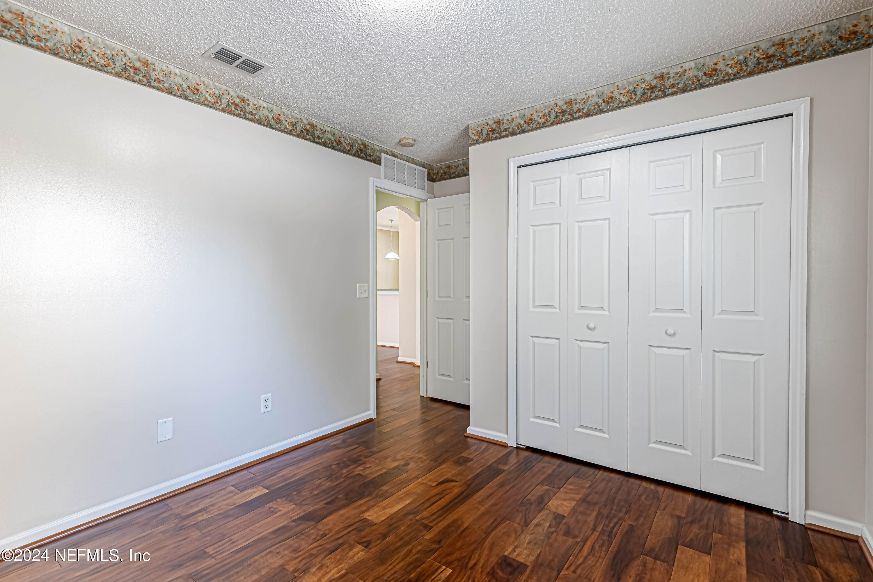 9380 Lockheed Lane Jacksonville, FL 32221 - Photo 27 of 40 a view of an empty room with wooden floor