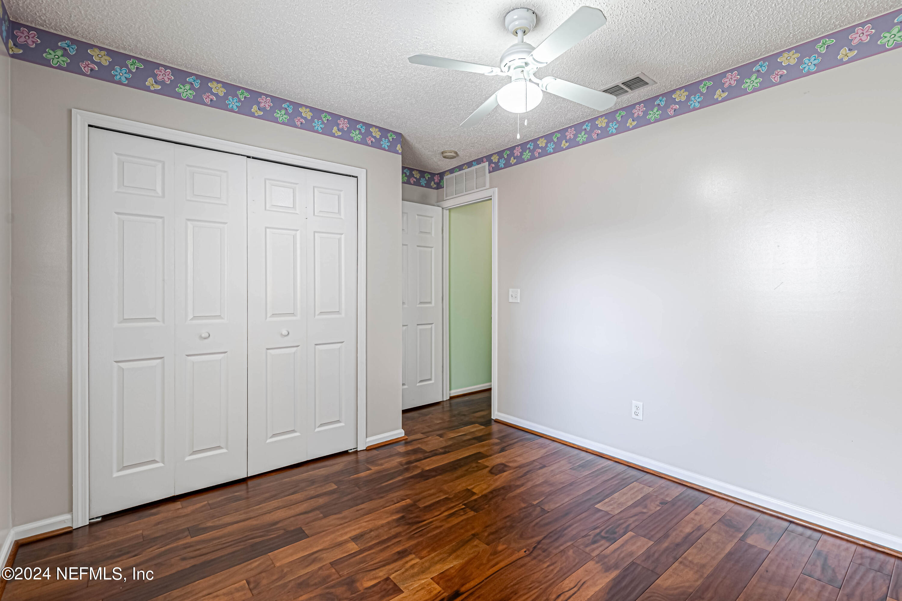 9380 Lockheed Lane Jacksonville, FL 32221 - Photo 29 of 40 a view of an empty room with wooden floor