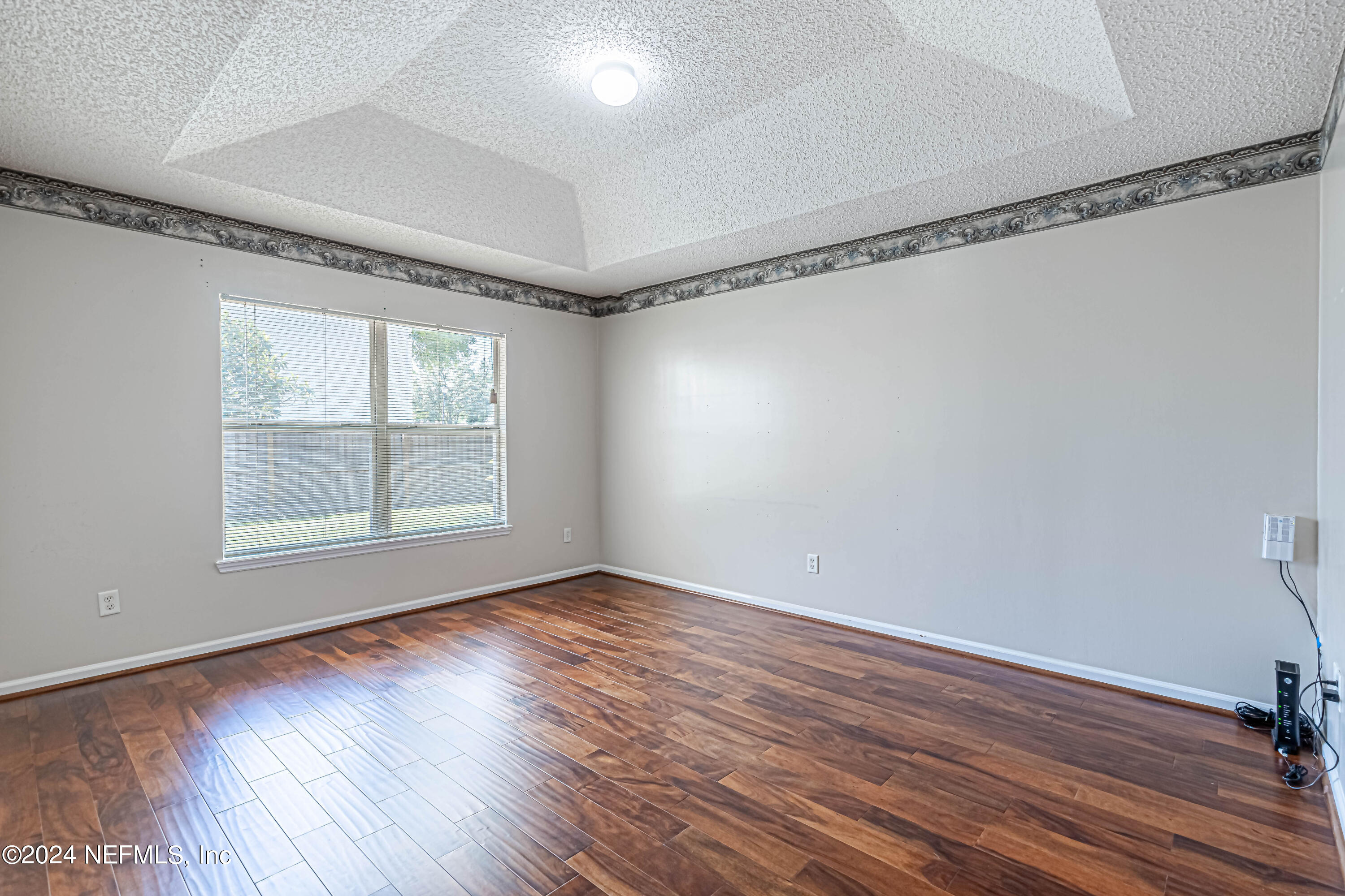9380 Lockheed Lane Jacksonville, FL 32221 - Photo 30 of 40 a view of a room with wooden floor and windows