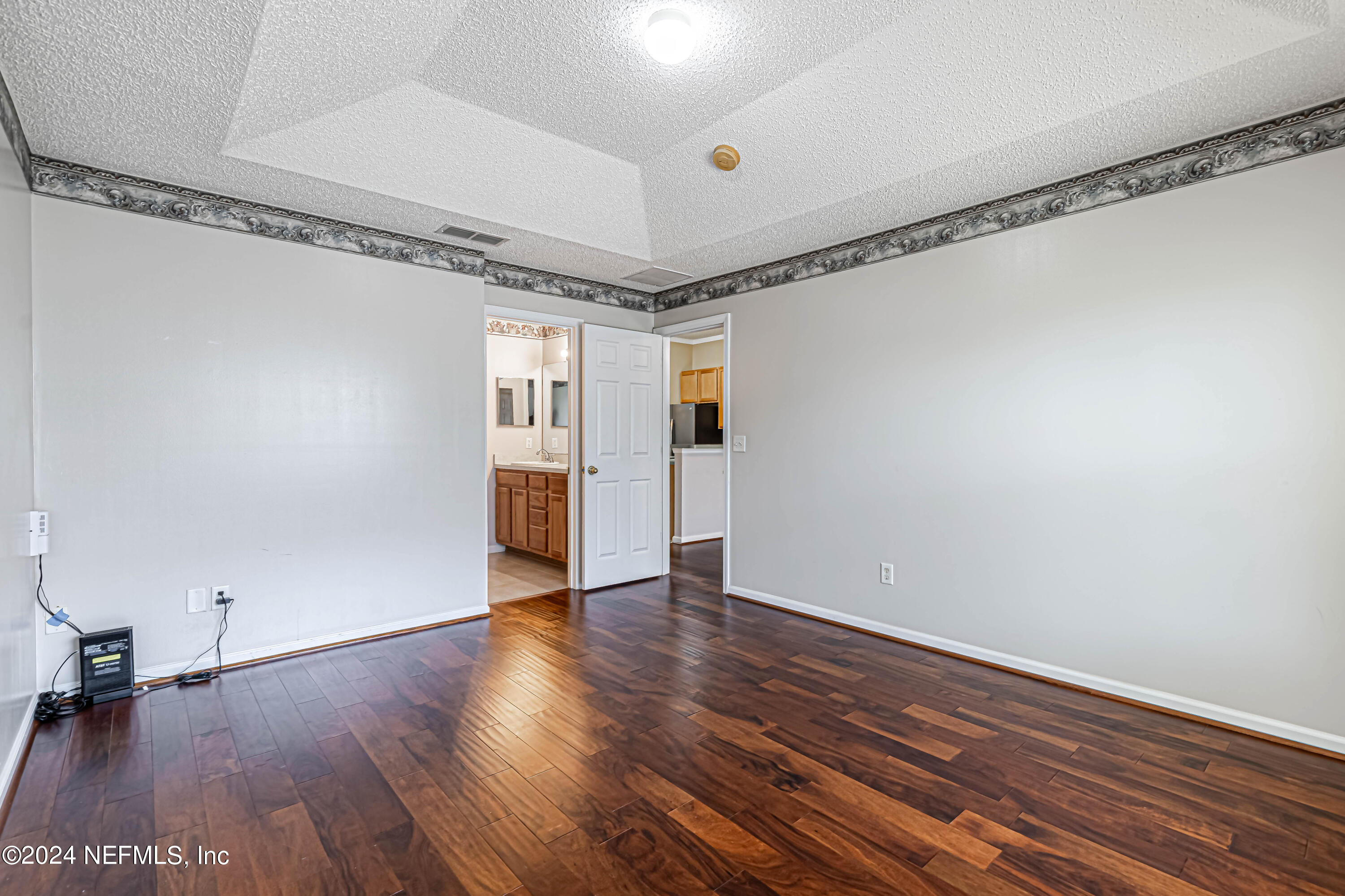 9380 Lockheed Lane Jacksonville, FL 32221 - Photo 32 of 40 a view of an empty room with wooden floor