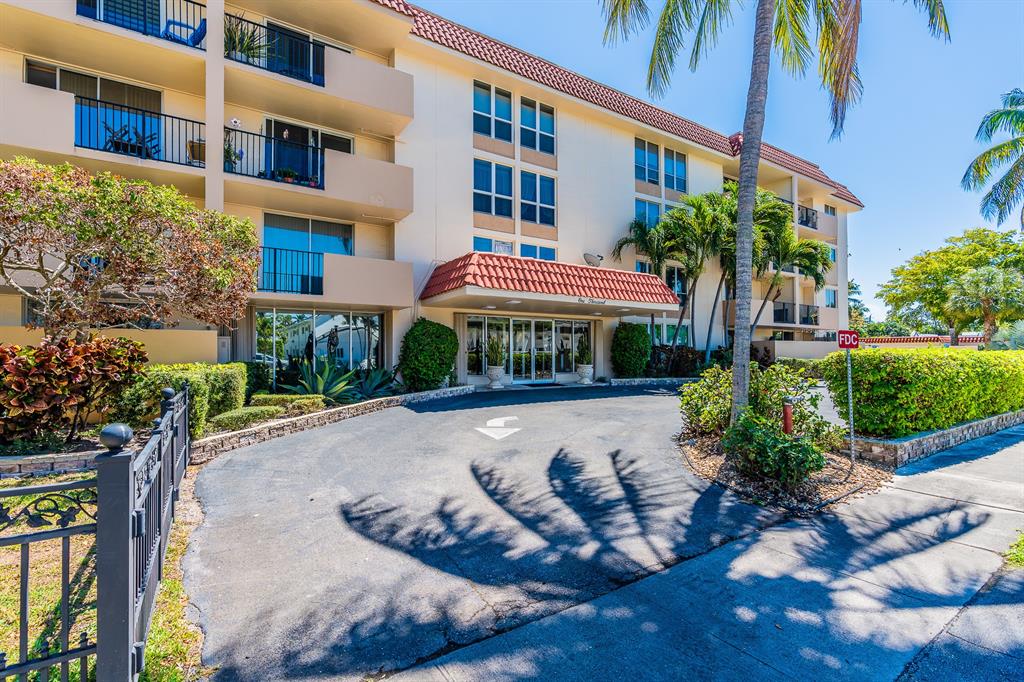 1000 Spanish River Road, Unit 3G Boca Raton, FL 33432 - Photo 1 of 31 a front view of a building with garden