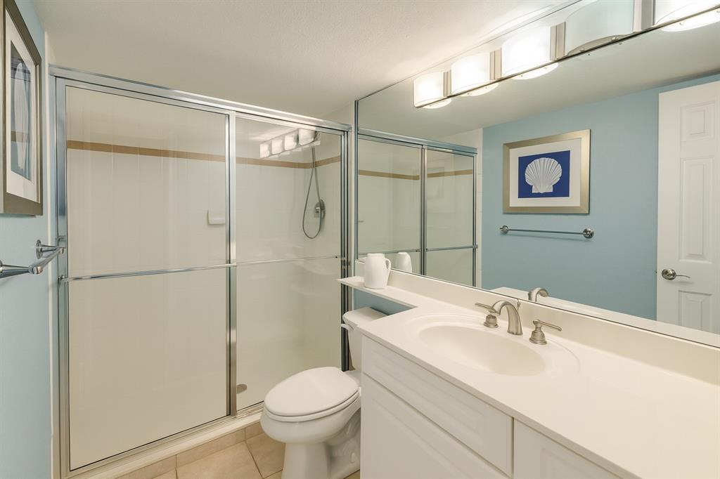 1000 Spanish River Road, Unit 3G Boca Raton, FL 33432 - Photo 11 of 31 a bathroom with a sink toilet and shower