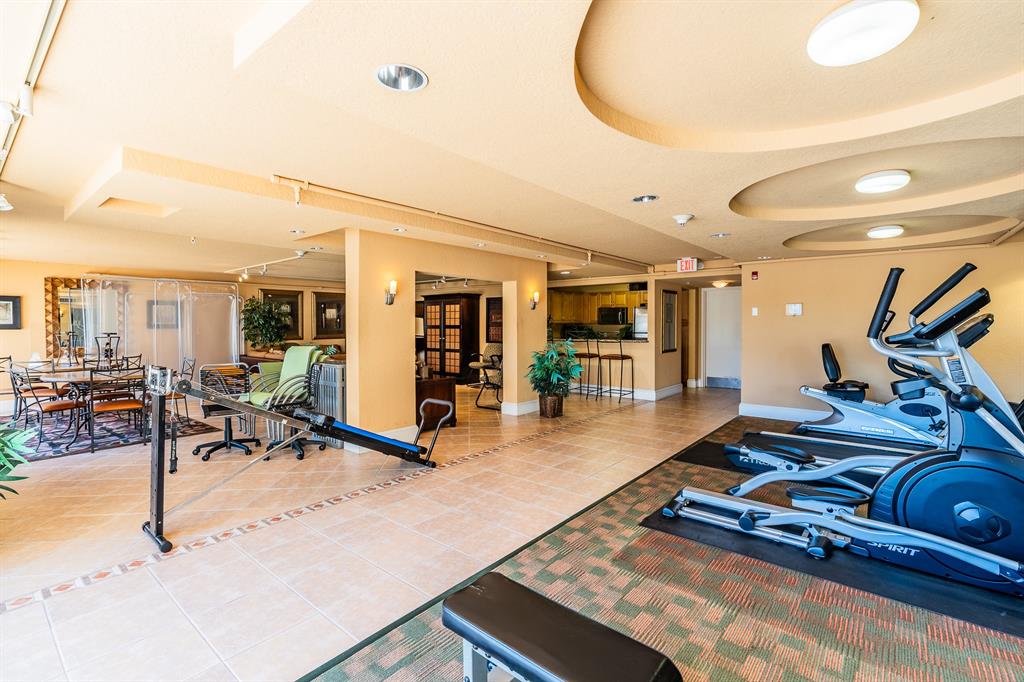 1000 Spanish River Road, Unit 3G Boca Raton, FL 33432 - Photo 24 of 31 a room with lots of gym equipment