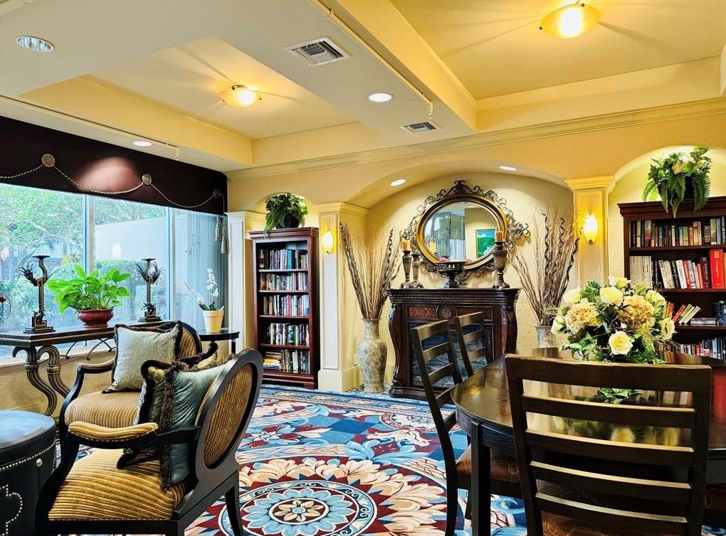 1000 Spanish River Road, Unit 3G Boca Raton, FL 33432 - Photo 25 of 31 a living room with furniture and a bookshelf