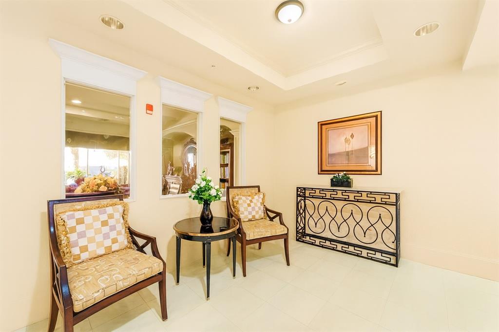 1000 Spanish River Road, Unit 3G Boca Raton, FL 33432 - Photo 26 of 31 a living room with furniture and a painting on the wall
