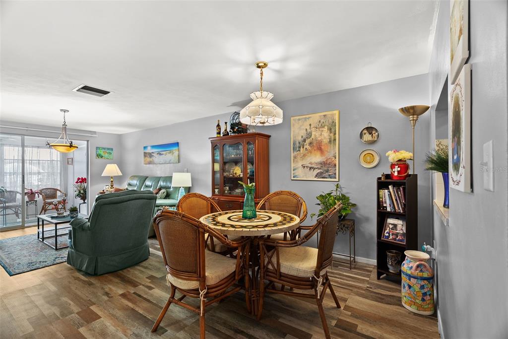 4227 Rax Place, Unit 4227 New Port Richey, FL 34652 - Photo 11 of 42 a dining room with furniture and window