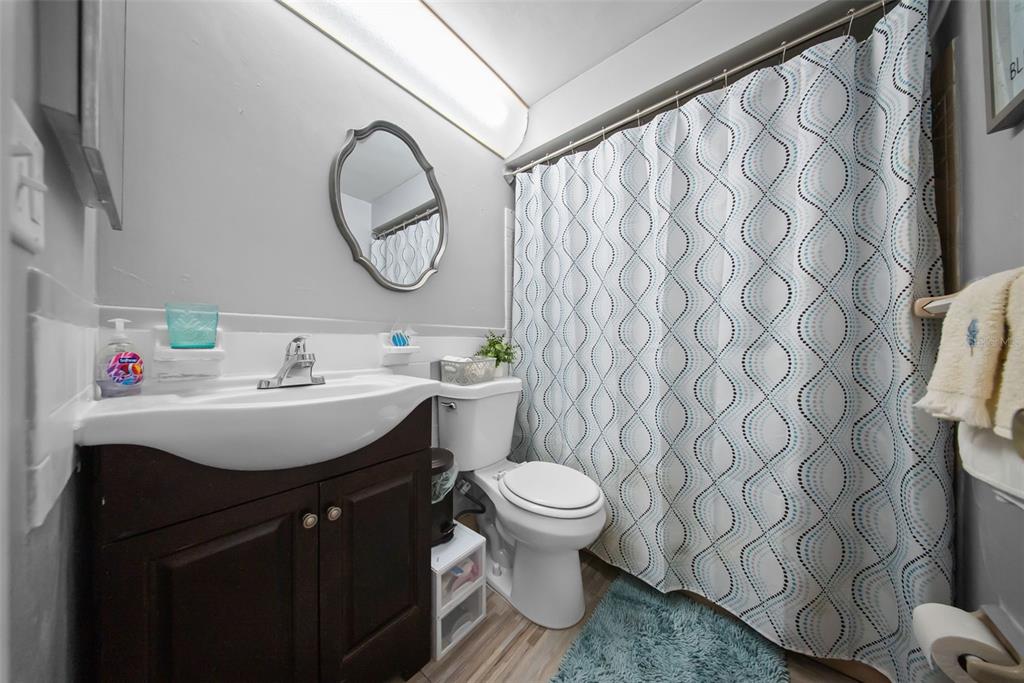 4227 Rax Place, Unit 4227 New Port Richey, FL 34652 - Photo 15 of 42 a bathroom with a sink toilet and a mirror