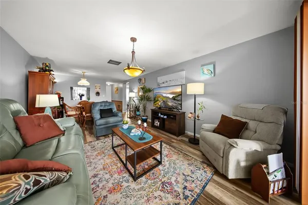 a living room with furniture and a window