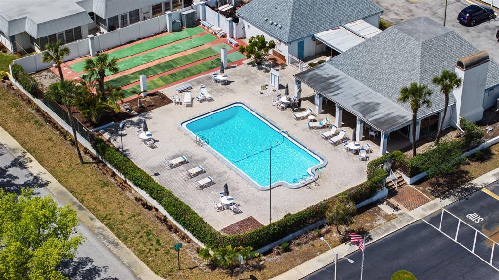 4227 Rax Place, Unit 4227 New Port Richey, FL 34652 - Photo 37 of 42 an aerial view of a tennis ground with a swimming pool