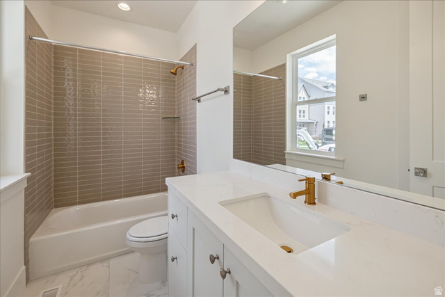 952 Mathilda Drive, Unit 156 Saratoga Springs, UT 84045 - Photo 18 of 25 Bathroom featuring a white vanity with a rectangular undermount sink, a gold-tone faucet, and a quartz countertop