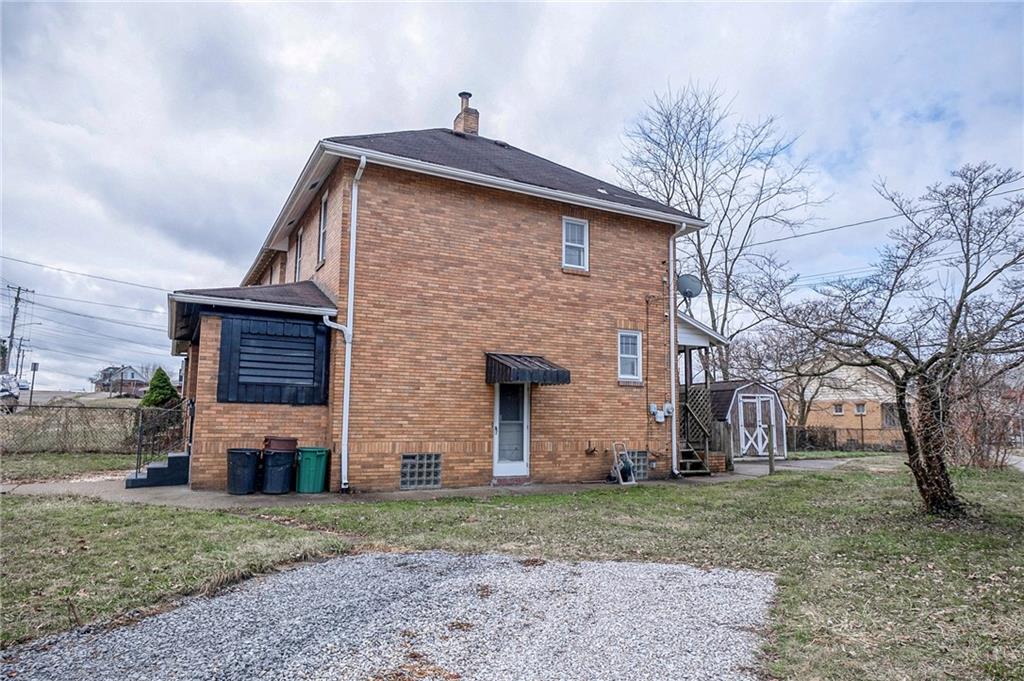 2399 Beaver Road Ambridge, PA 15003 - Photo 21 of 24 a front view of a house with a garden
