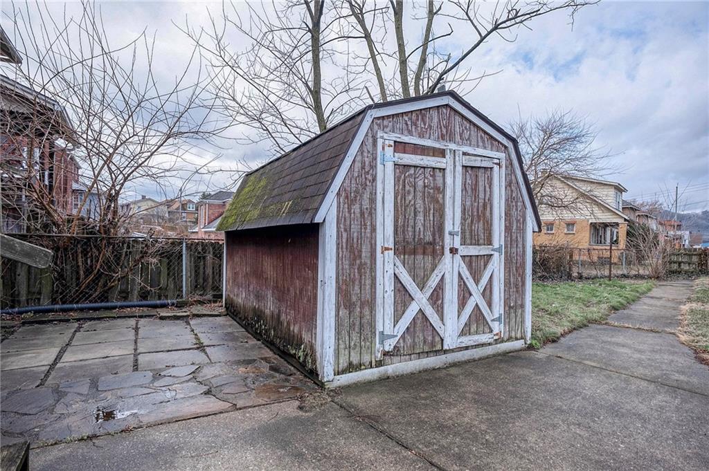 2399 Beaver Road Ambridge, PA 15003 - Photo 22 of 24 a front view of a house with garden