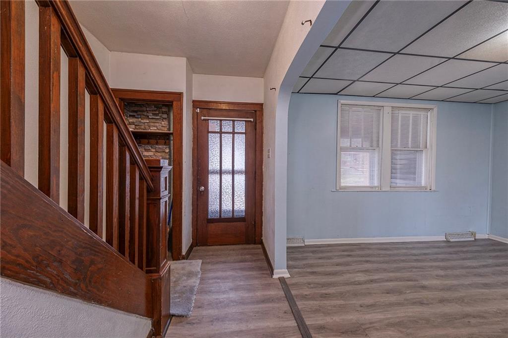 2399 Beaver Road Ambridge, PA 15003 - Photo 5 of 24 a view of a hallway with wooden floor and entryway