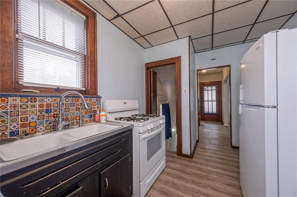 2399 Beaver Road Ambridge, PA 15003 - Photo 9 of 24 a kitchen with a stove and a refrigerator