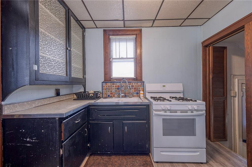2399 Beaver Road Ambridge, PA 15003 - Photo 10 of 24 a kitchen with a stove and a sink