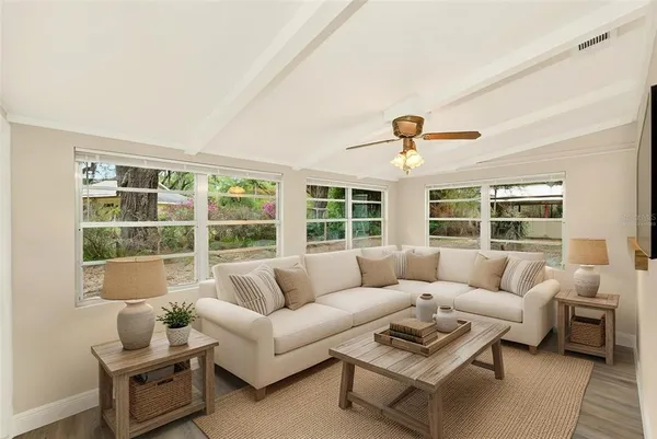 a living room with furniture and a large window