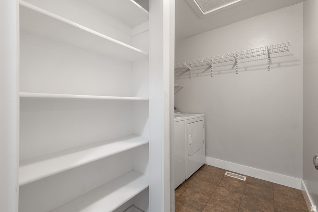 273 West 1010th Street South Logan, UT 84321 - Photo 17 of 19 Laundry area featuring baseboards and separate washer and dryer
