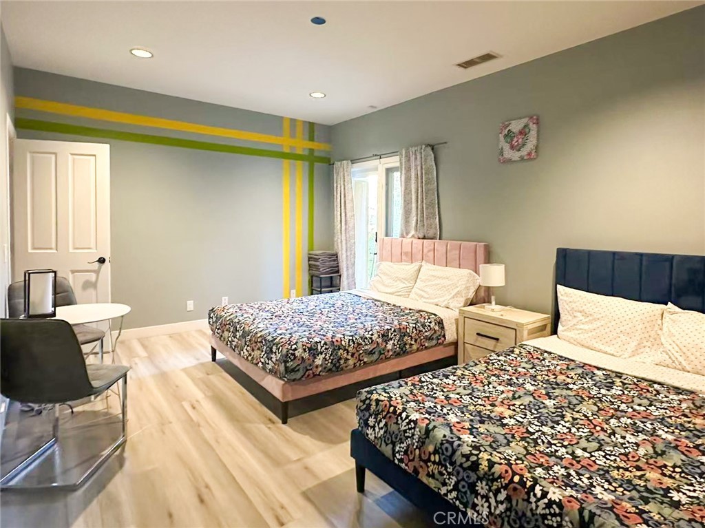 45700 Adler Lane Temecula, CA 92590 - Photo 11 of 20 a bedroom with two beds and painting on the wall