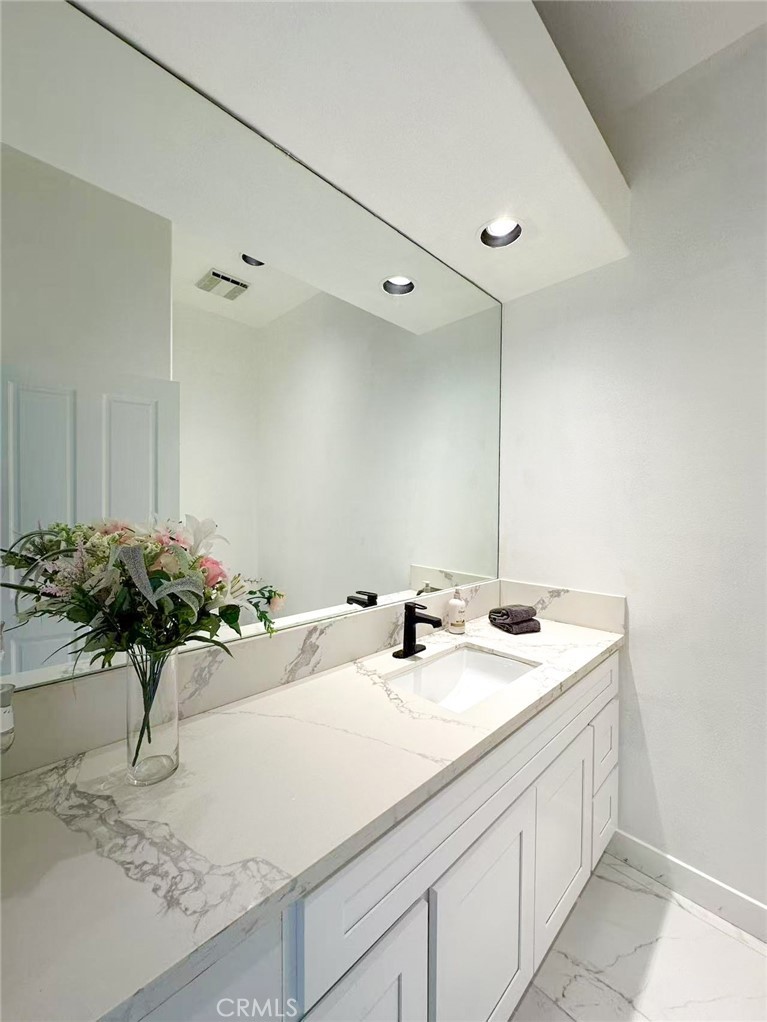 45700 Adler Lane Temecula, CA 92590 - Photo 17 of 20 a bathroom with a sink and a mirror