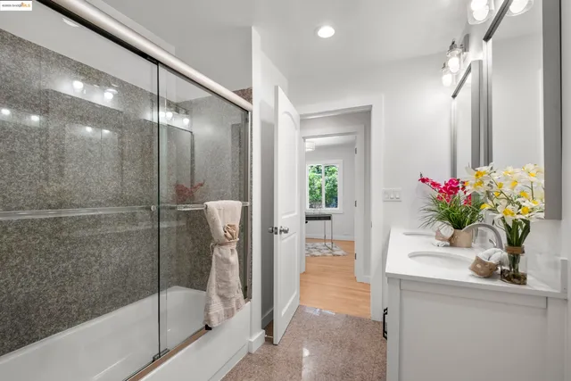a bathroom with a shower and a sink