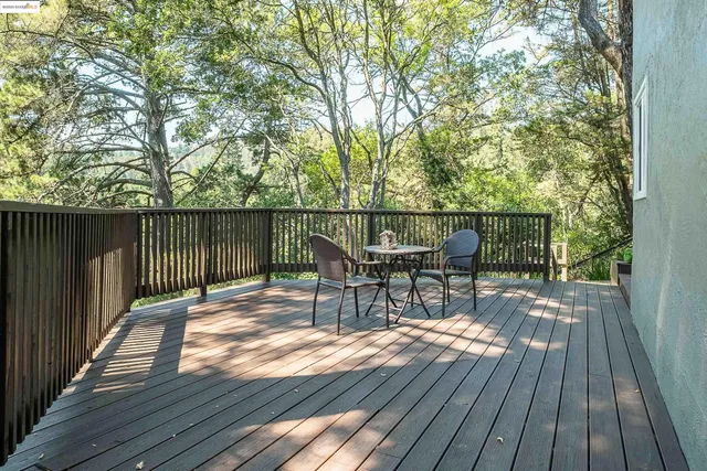 a view of a patio with wooden floor and outdoor seating