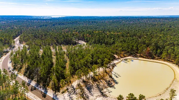 a view of a field with an ocean