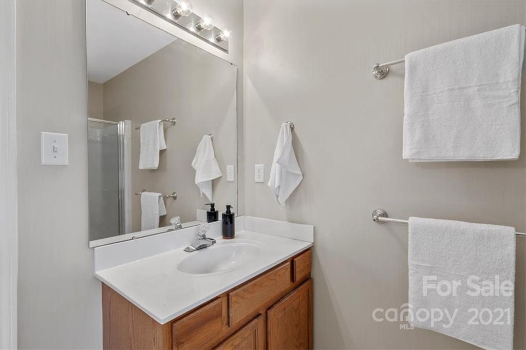3919 Faith Church Road Indian Trail, NC 28079 - Photo 20 of 34 a bathroom with a sink and a mirror
