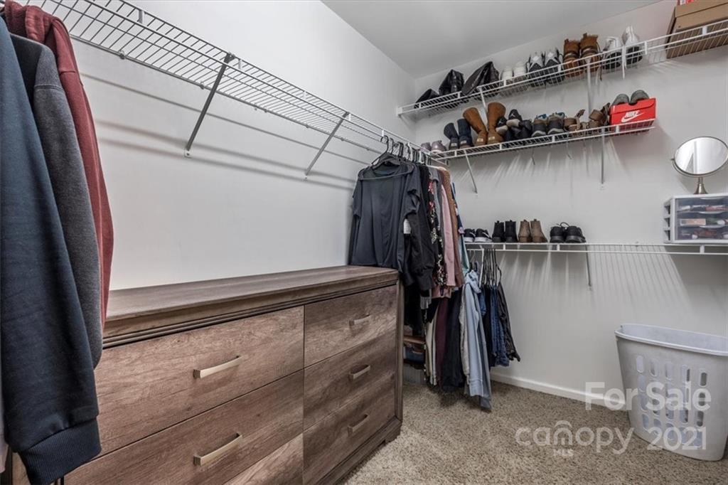 3919 Faith Church Road Indian Trail, NC 28079 - Photo 24 of 34 a view of walk in closet with clothes and shoes